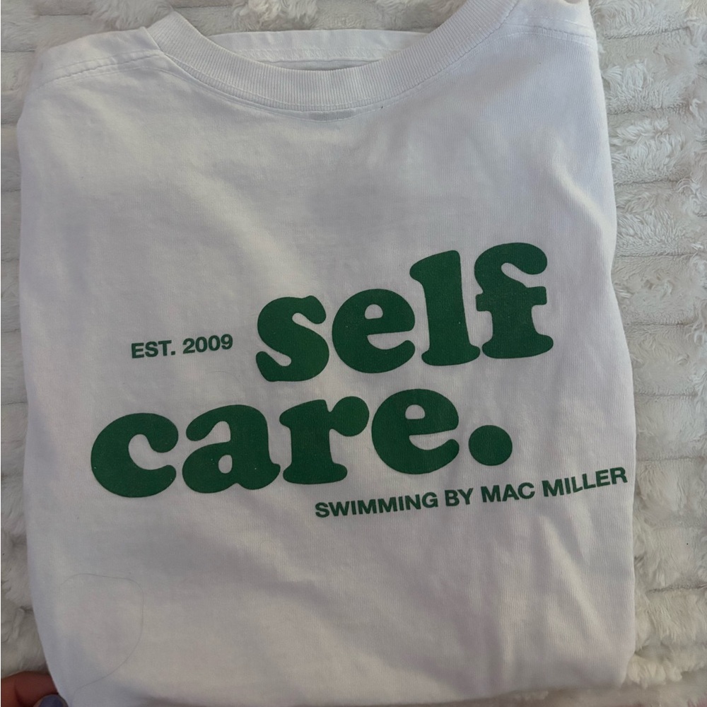 White Graphic Tee with Green Text